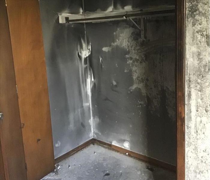 closet with extensive smoke and soot damage 