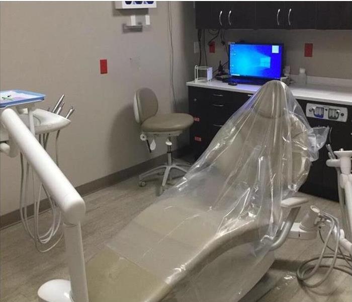 neutral colored dentist office with dental chair 