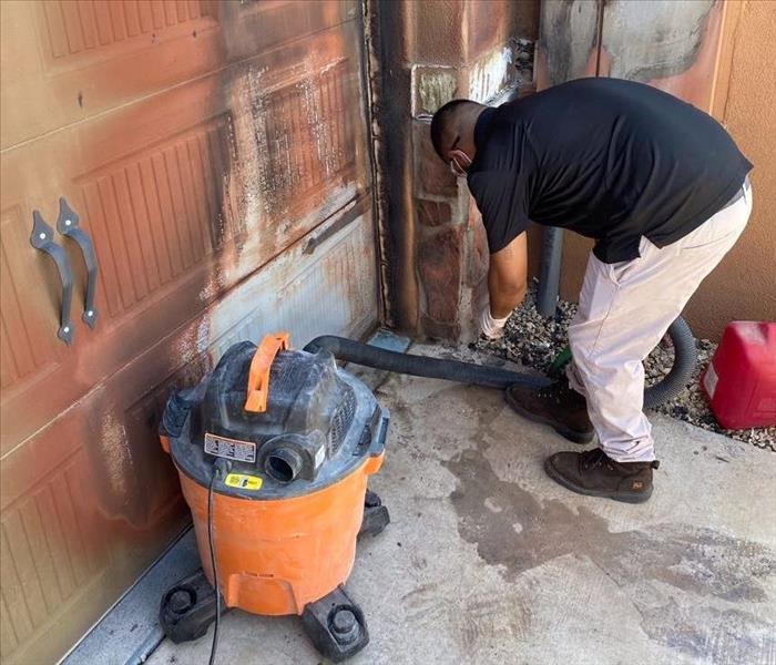 SERVPRO technician cleaning up from fire damage 