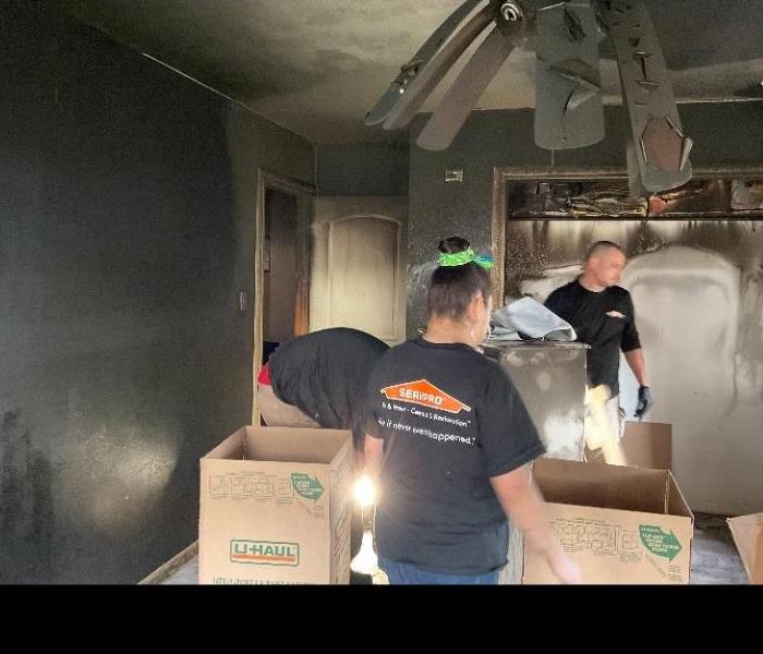 SERVPRO Team cleaning up after a residential fire