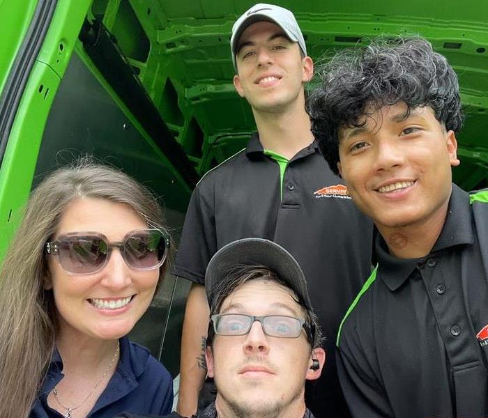 Selfie of 4 SERVPRO employees. One female and 3 males smiling at the camera.
